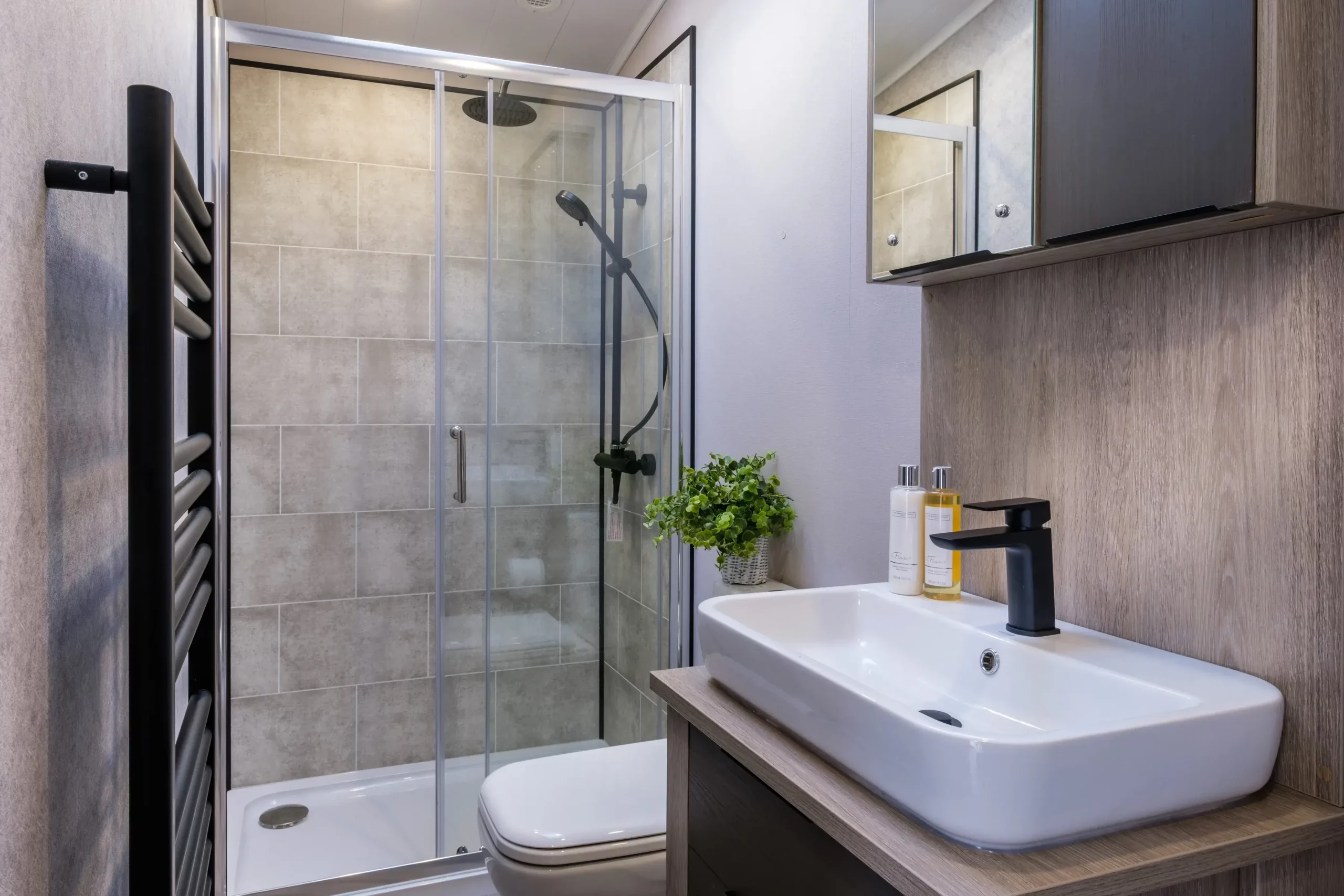 The shower room with walk-in shower and modern basin