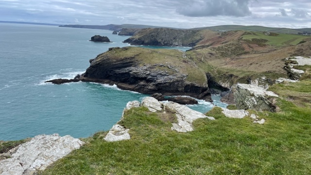 Clear blue sea and a rocky island off the Cornish coast
